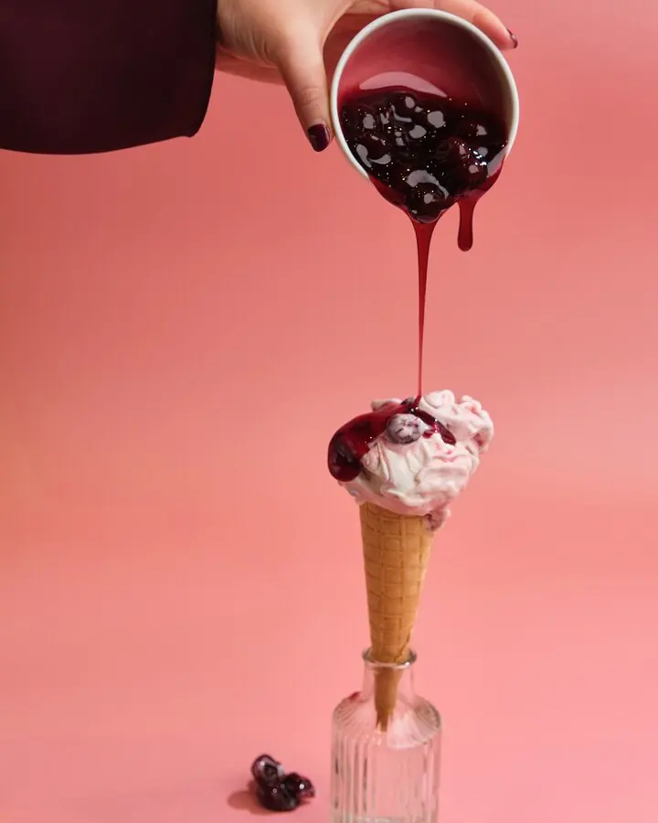 Berry sauce poured over a gelato cone at Glacier Bargello